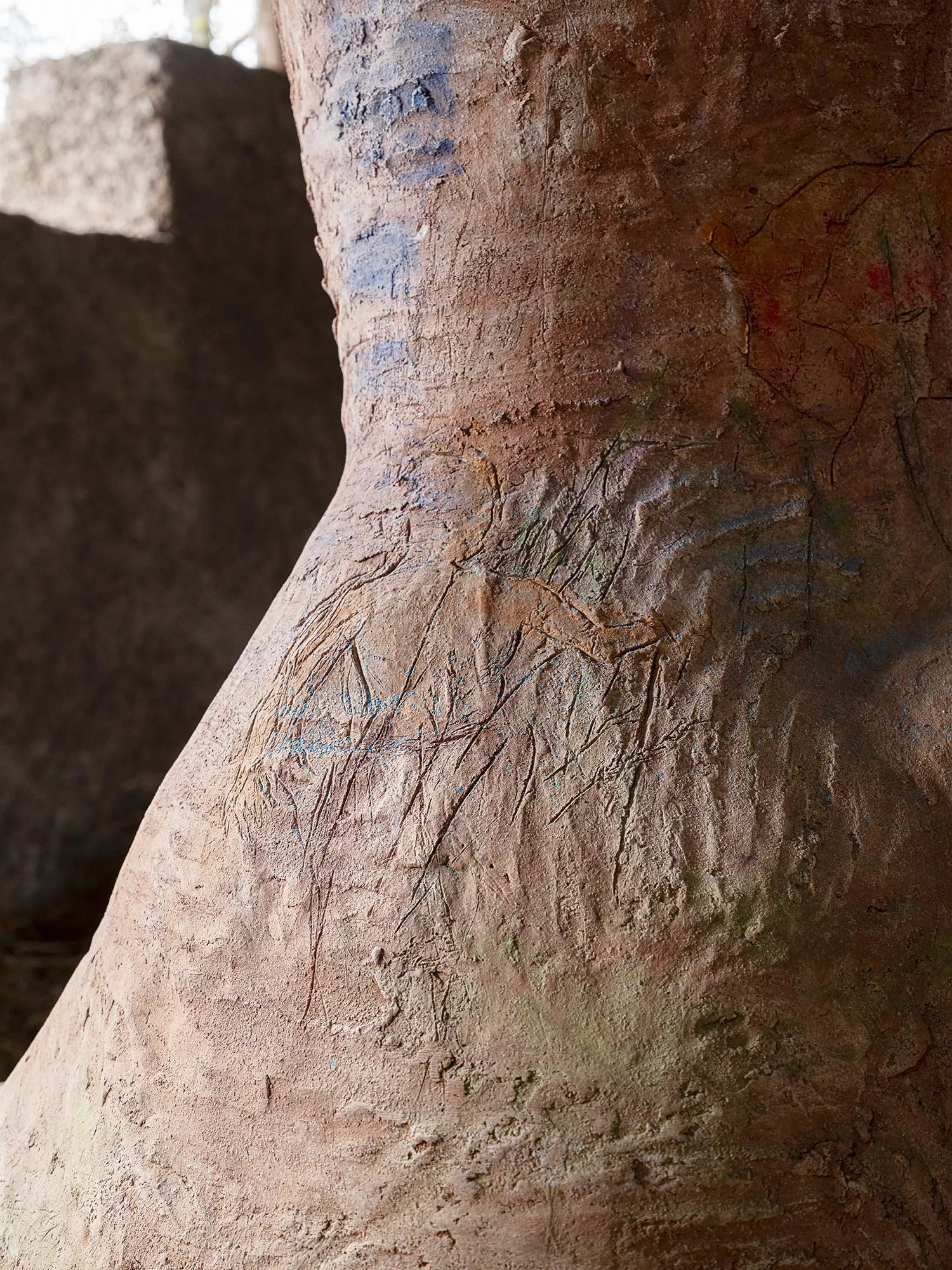 Gaia Fugazza - Gaia Fugazza, Mother of Millions, 2025, close-up view of the sculpture’s torso, with engraved lines and a rough, textured surface.