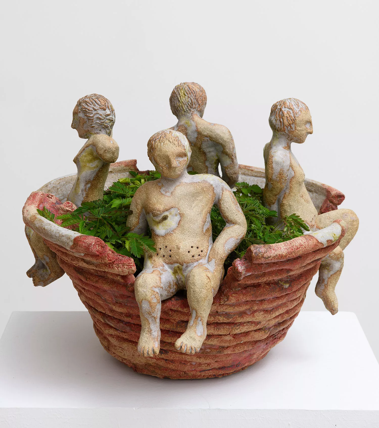 Gaia Fugazza - Gaia Fugazza, Vase for Mimosa pudica, 2023, stoneware ceramic sculpture featuring human figures and a Mimosa pudica plant growing from the centre.